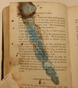 damaged chemistry textbook with stain